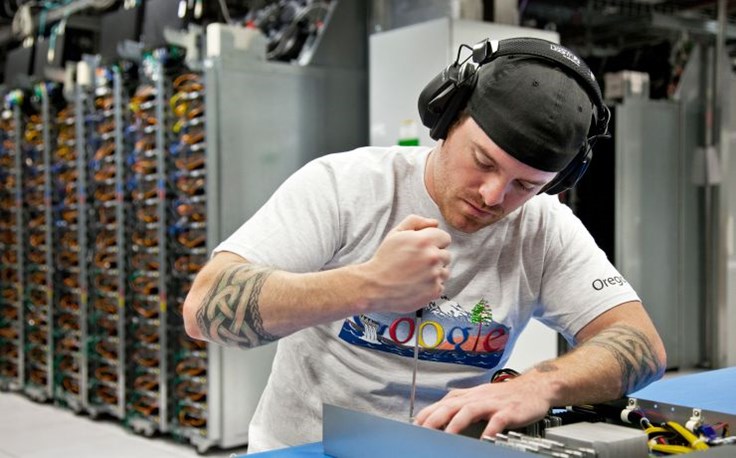 Mike Barham swaps out a motherboard. When server parts break, we first try to repair them. If we can't, we break them up into raw materials (steel, plastic, copper, etc.) and recycle the components..jpg